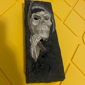 Grim reaper incense burner featuring